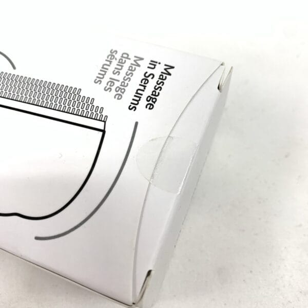 Overhead top-down view of PMD Clean facial cleanser showing brush head design