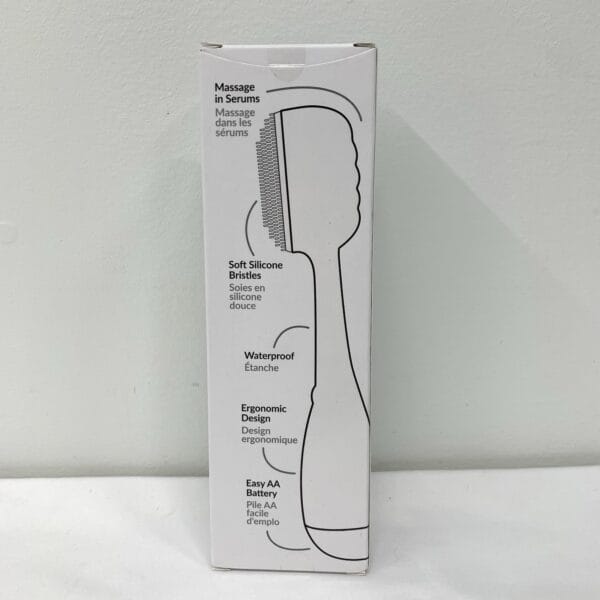 Side profile of PMD Clean Smart Facial Device showing curved handle and silicone bristles