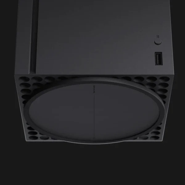 Close-up of Xbox Series X hardware showing power button, USB port, and texture