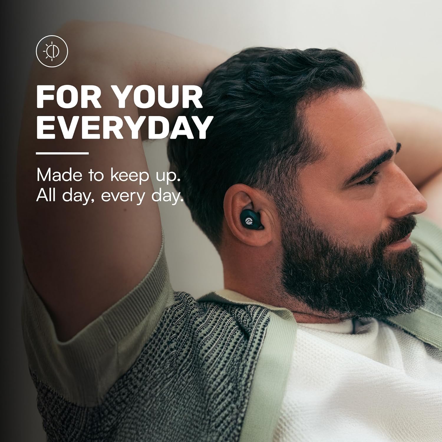 Man wearing Raycon earbuds while relaxing – wireless earbuds for everyday use