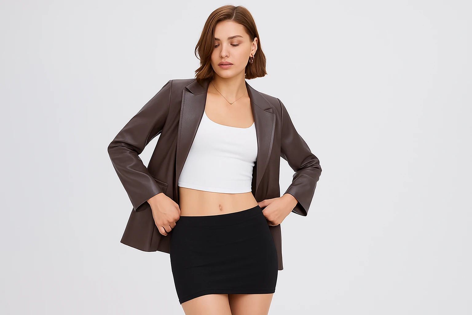 Woman wearing a black mini skirt styled with a fitted top and heels