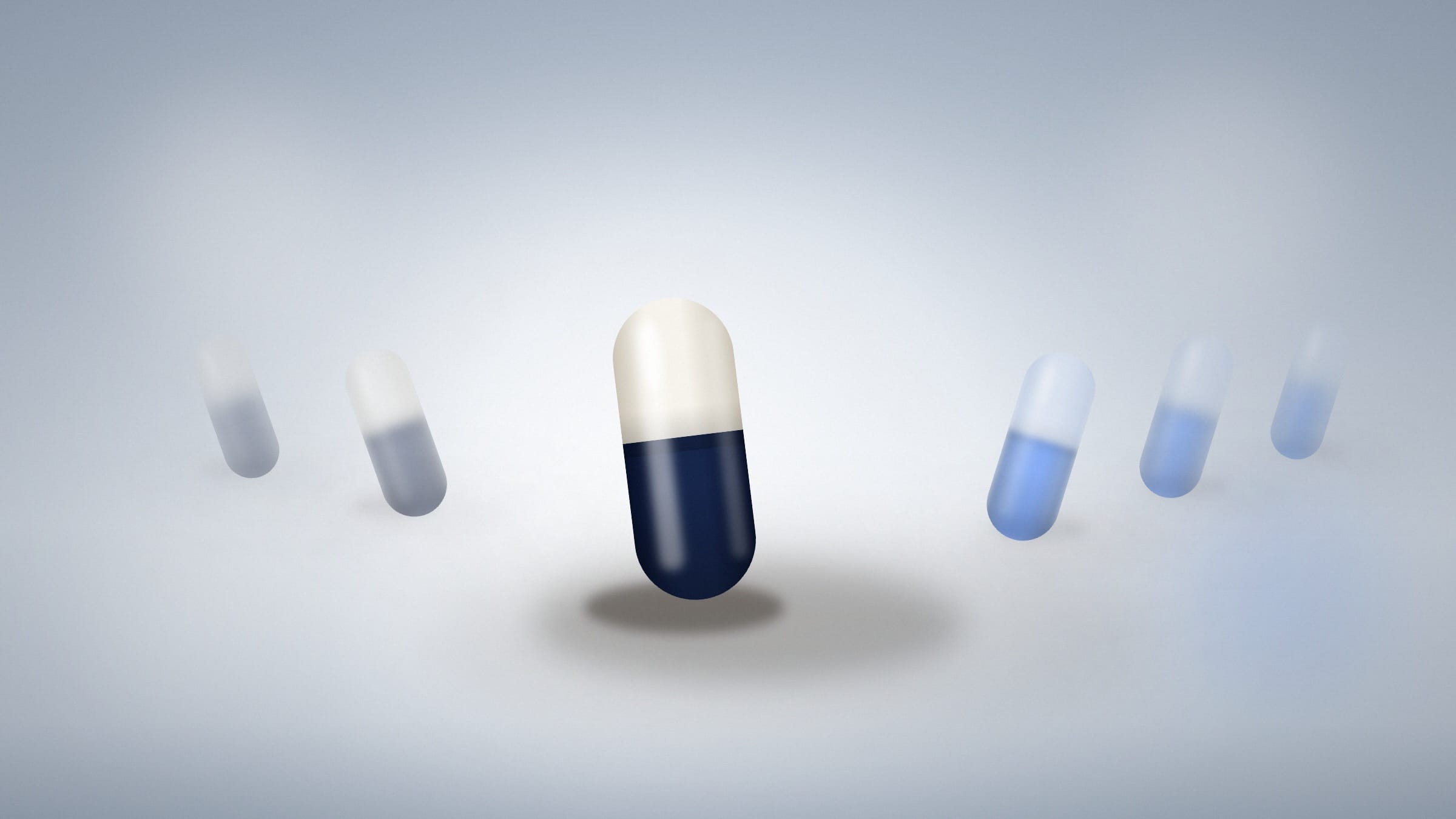 One probiotic capsule in sharp focus among blurred others, showing how probiotic strains differ between products